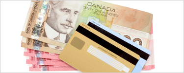 Canadian dollar bills and credit cards